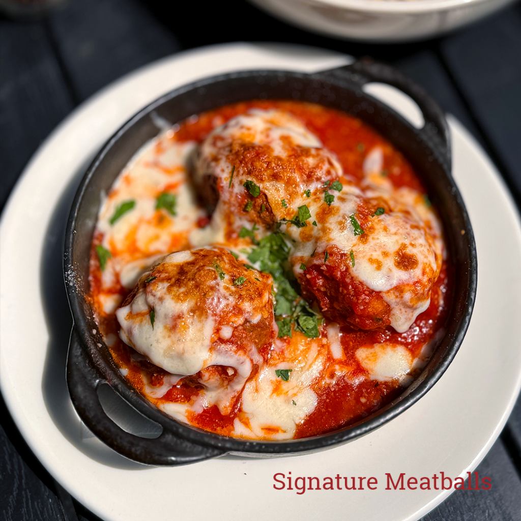 Marias signature meatballs covered in mozzarella cheese