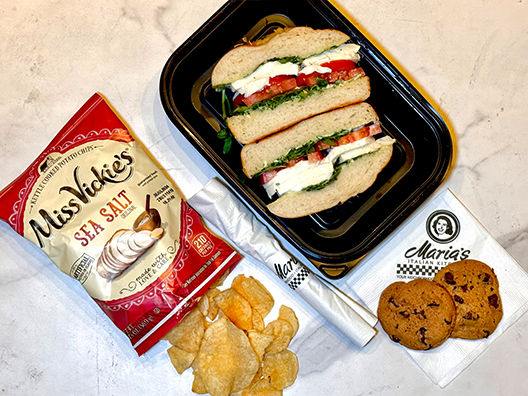 caprese sandwich lunch box with chips and cookie