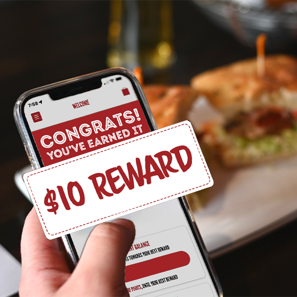 hand holding phone with $10 reward on screen