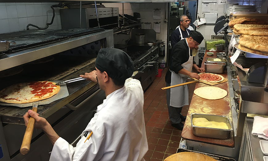 Cooks working in a Maria's kitchen